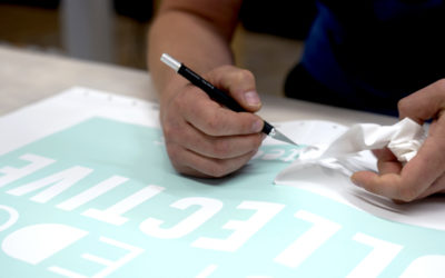 What are the benefits of a climate-controlled sign shop?