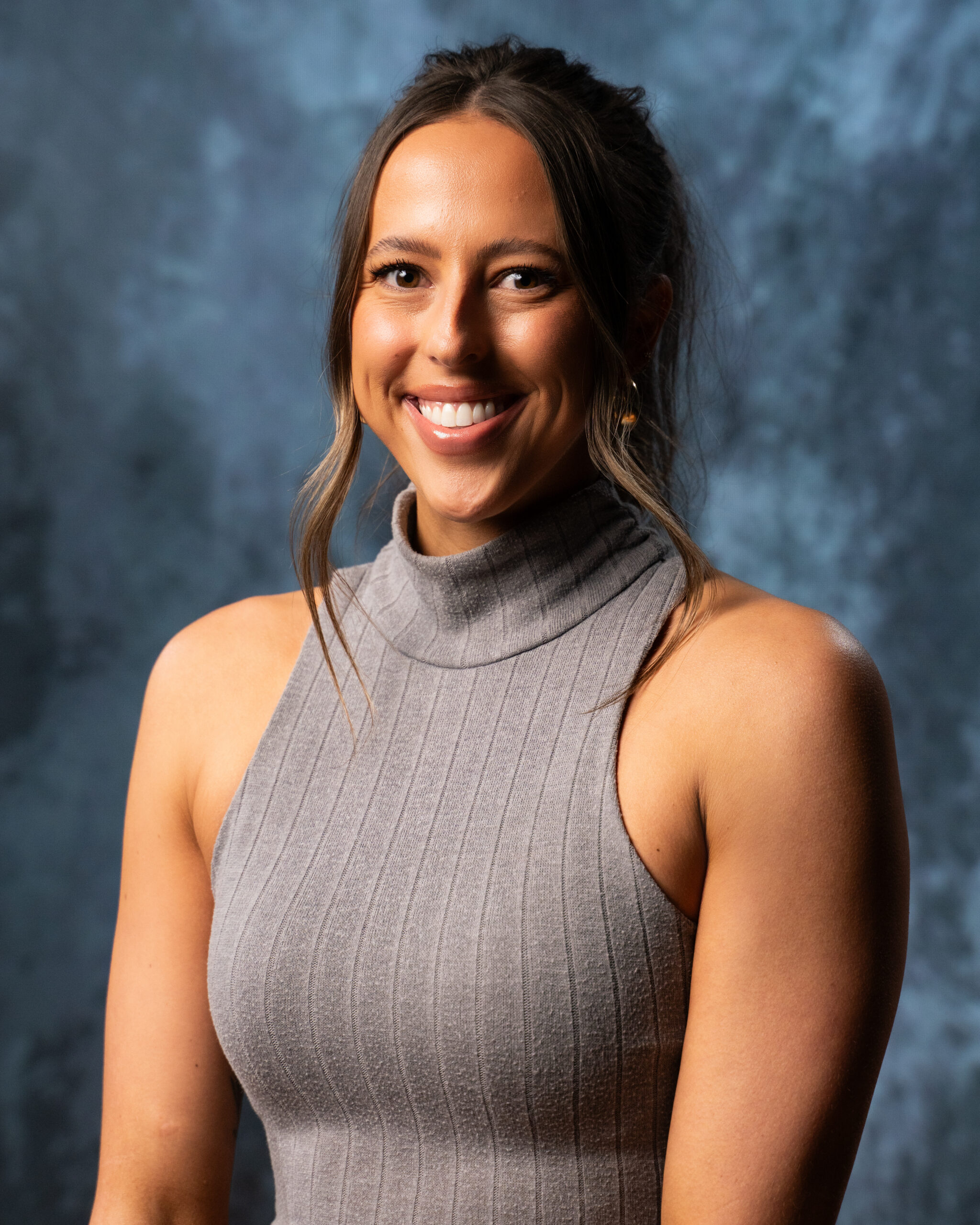 Man smiling with blue background